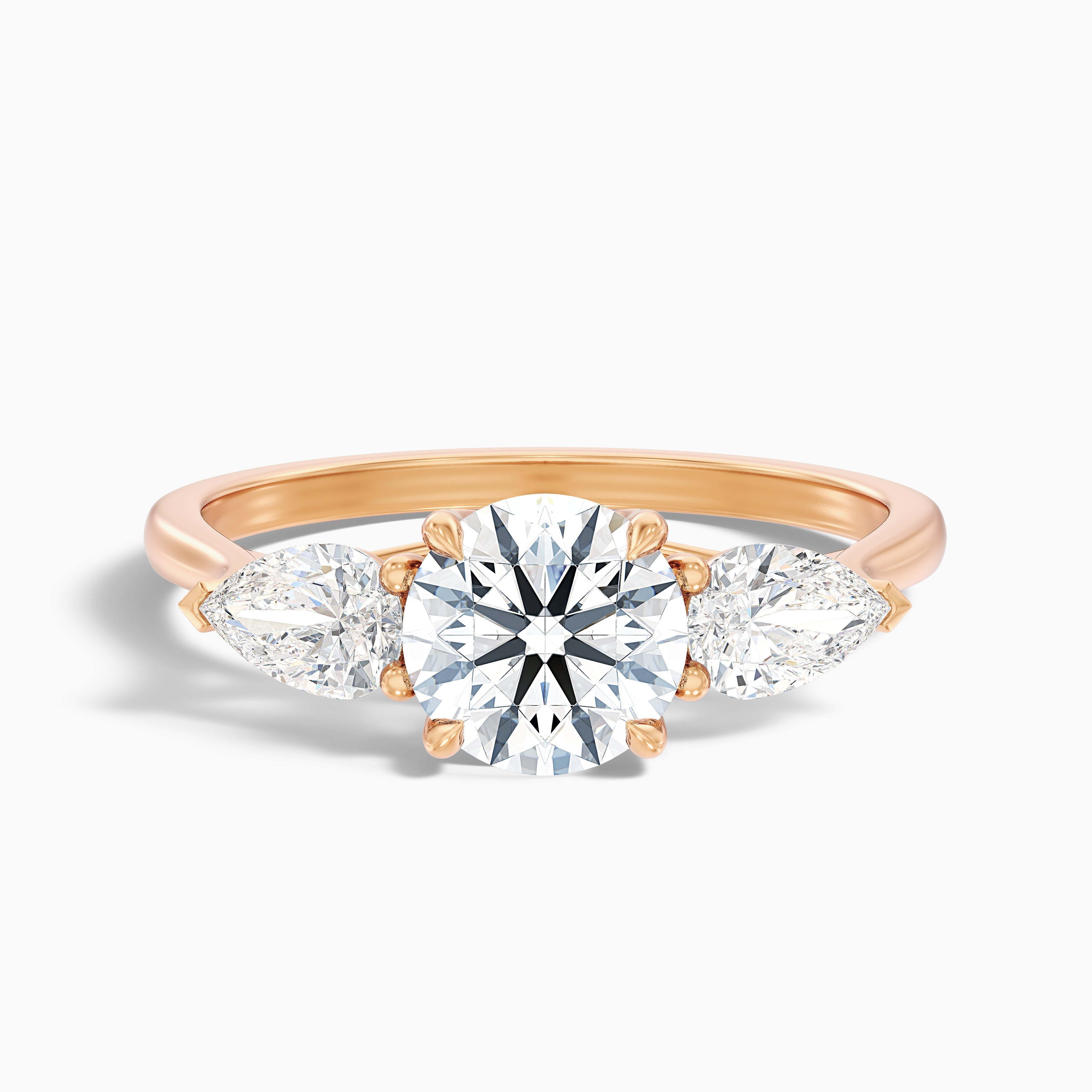 Amaya 4.5 Carat Round 3 Stone Moissanite Diamond Ring With Pear Side Stone in 18k Rose Gold