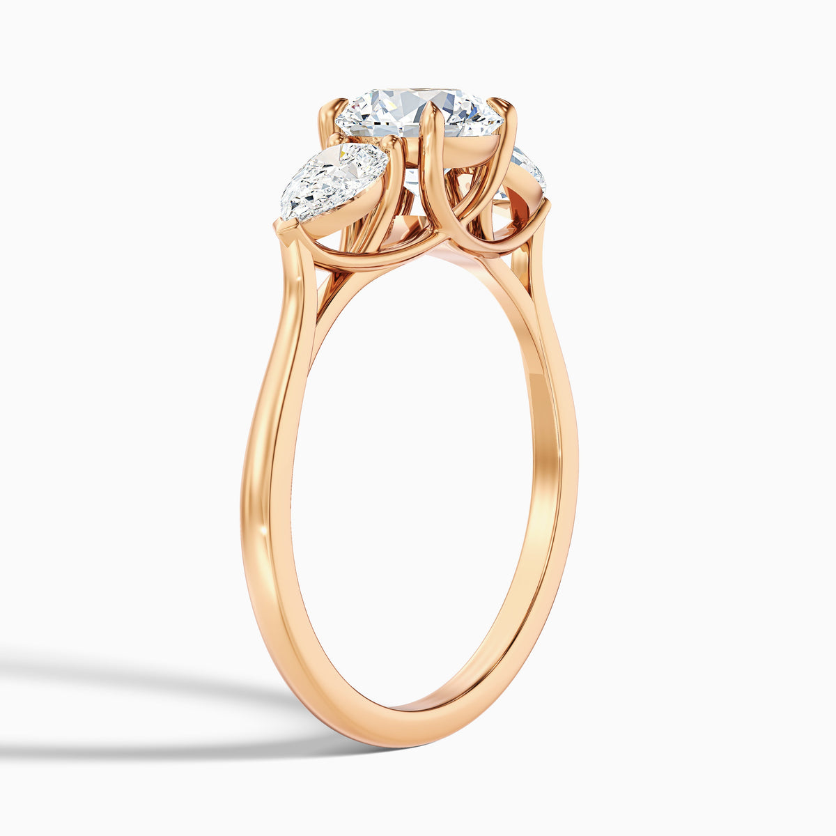 Amaya 3 Carat Round 3 Stone Moissanite Diamond Ring With Pear Side Stone in 18k Rose Gold