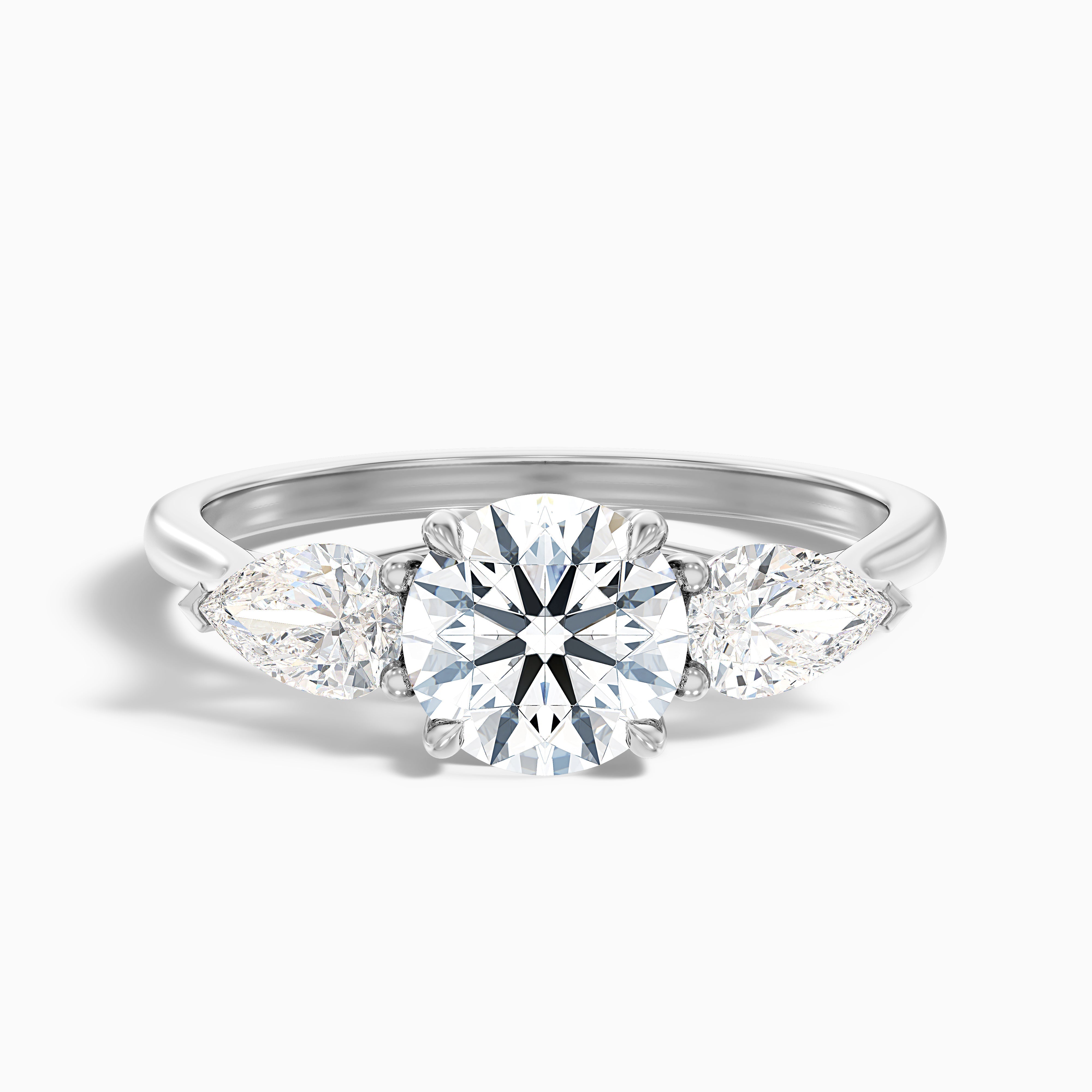 Amaya 1 Carat Round 3 Stone Moissanite Diamond Ring With Pear Side Stone in 18k White Gold