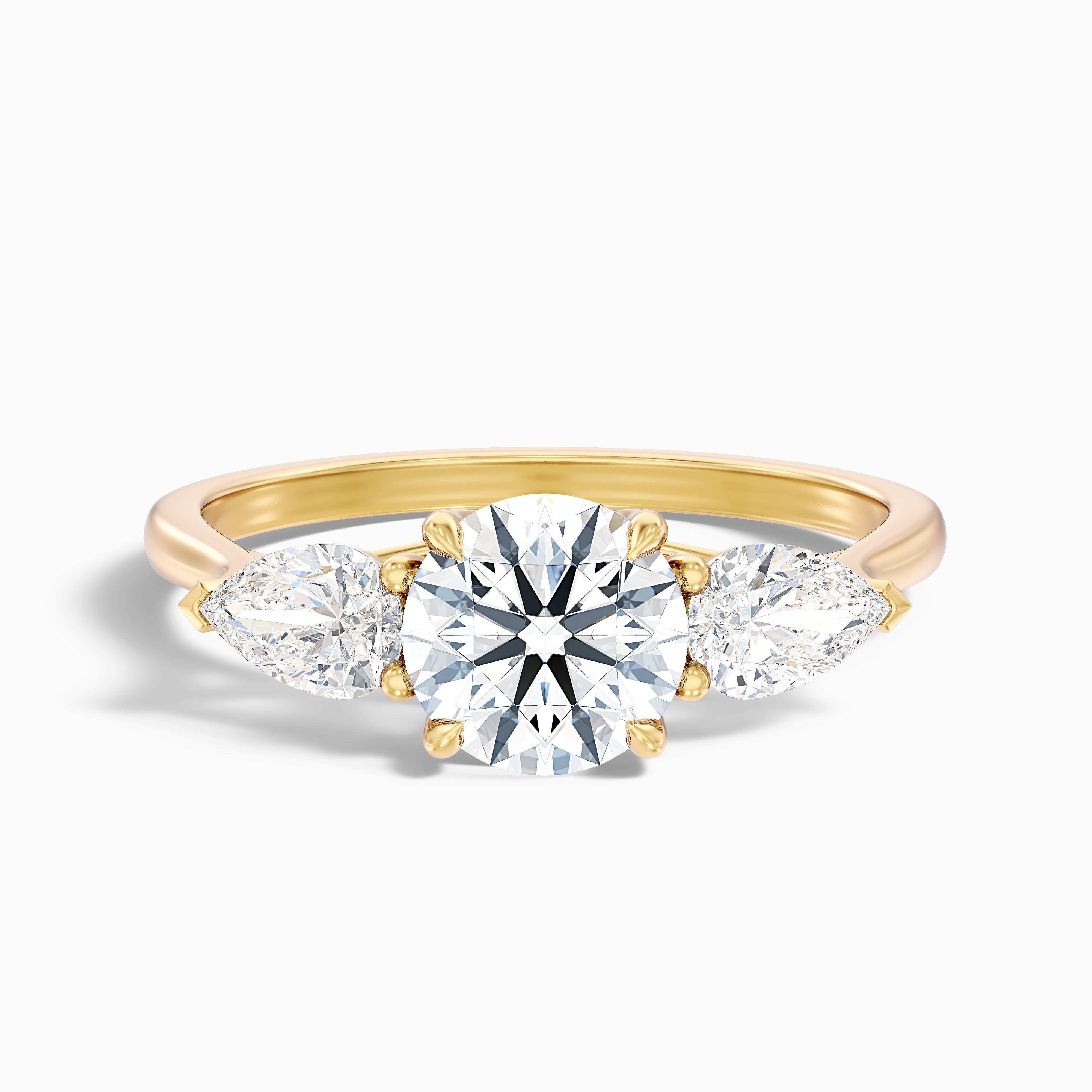 Amaya 4.5 Carat Round 3 Stone Moissanite Diamond Ring With Pear Side Stone in 18k Yellow Gold