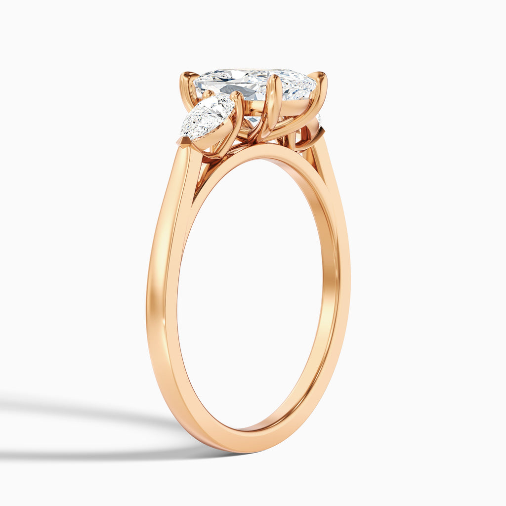 Haley 2.5 Carat Three Stone Ring with Pear Side Stones and an Elongated Cushion Lab Grown Diamond in 14k Yellow Gold