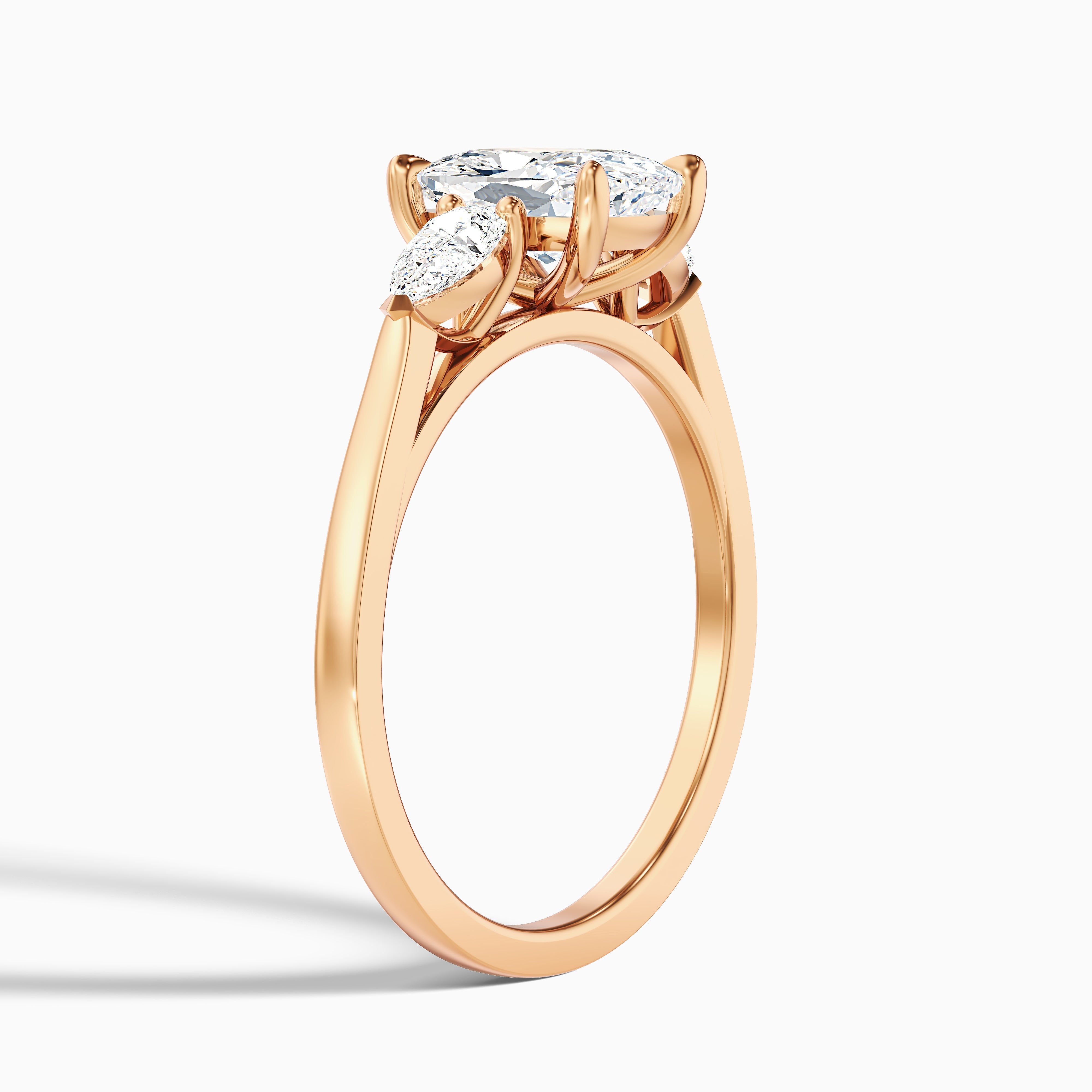Haley 2.5 Carat Three Stone Ring with Pear Side Stones and an Elongated Cushion Lab Grown Diamond in 14k Yellow Gold