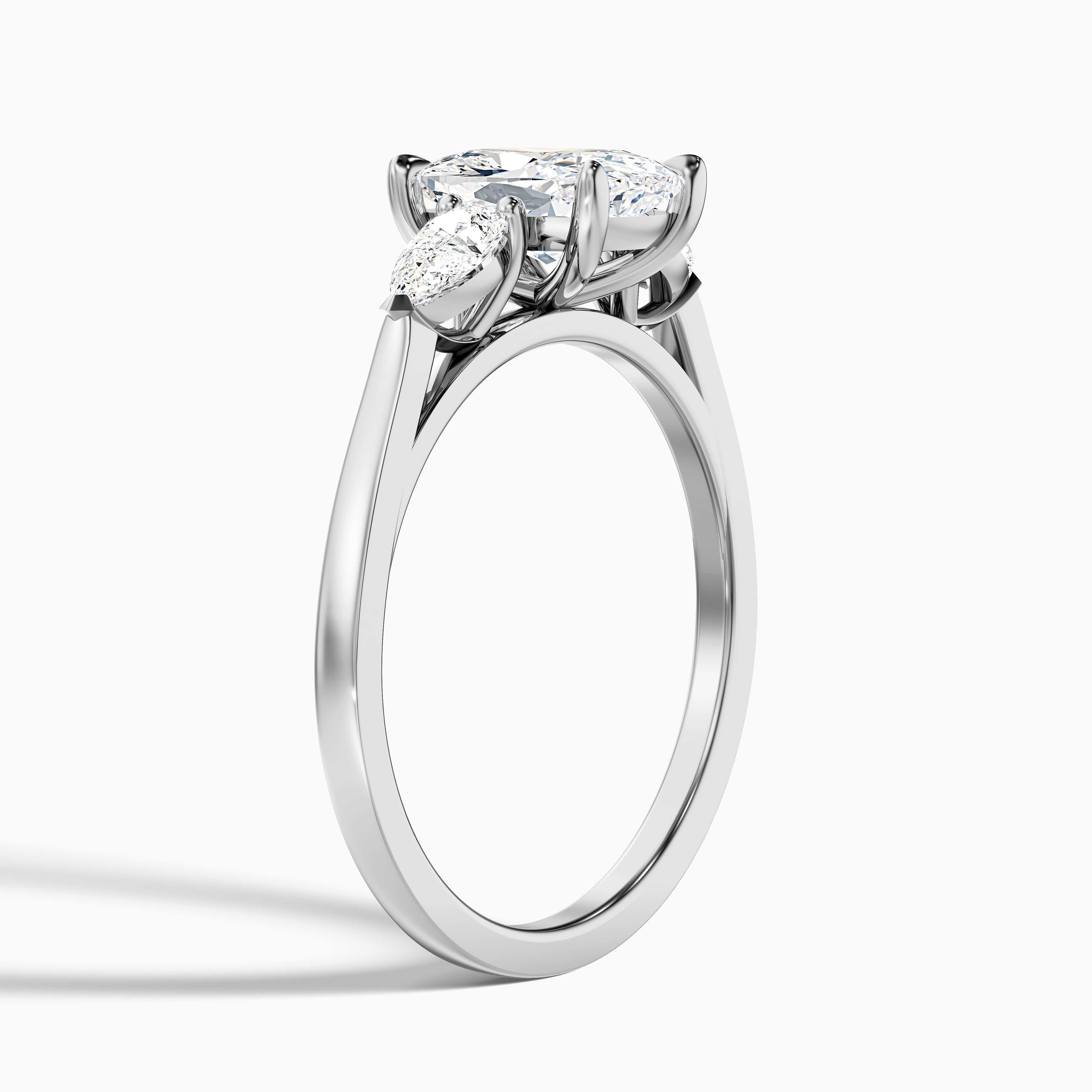 Haley 2.5 Carat Three Stone Ring with Pear Side Stones and an Elongated Cushion Lab Grown Diamond in 14k Yellow Gold