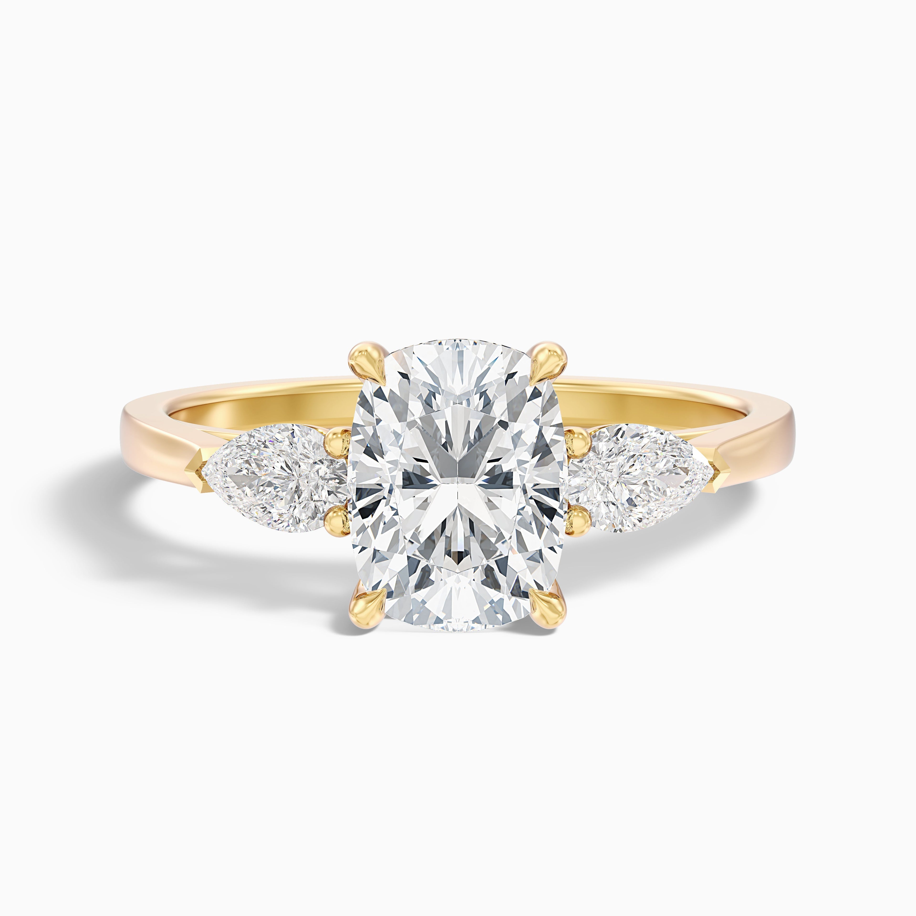 Haley 2.5 Carat Three Stone Ring with Pear Side Stones and an Elongated Cushion Lab Grown Diamond in 14k Yellow Gold