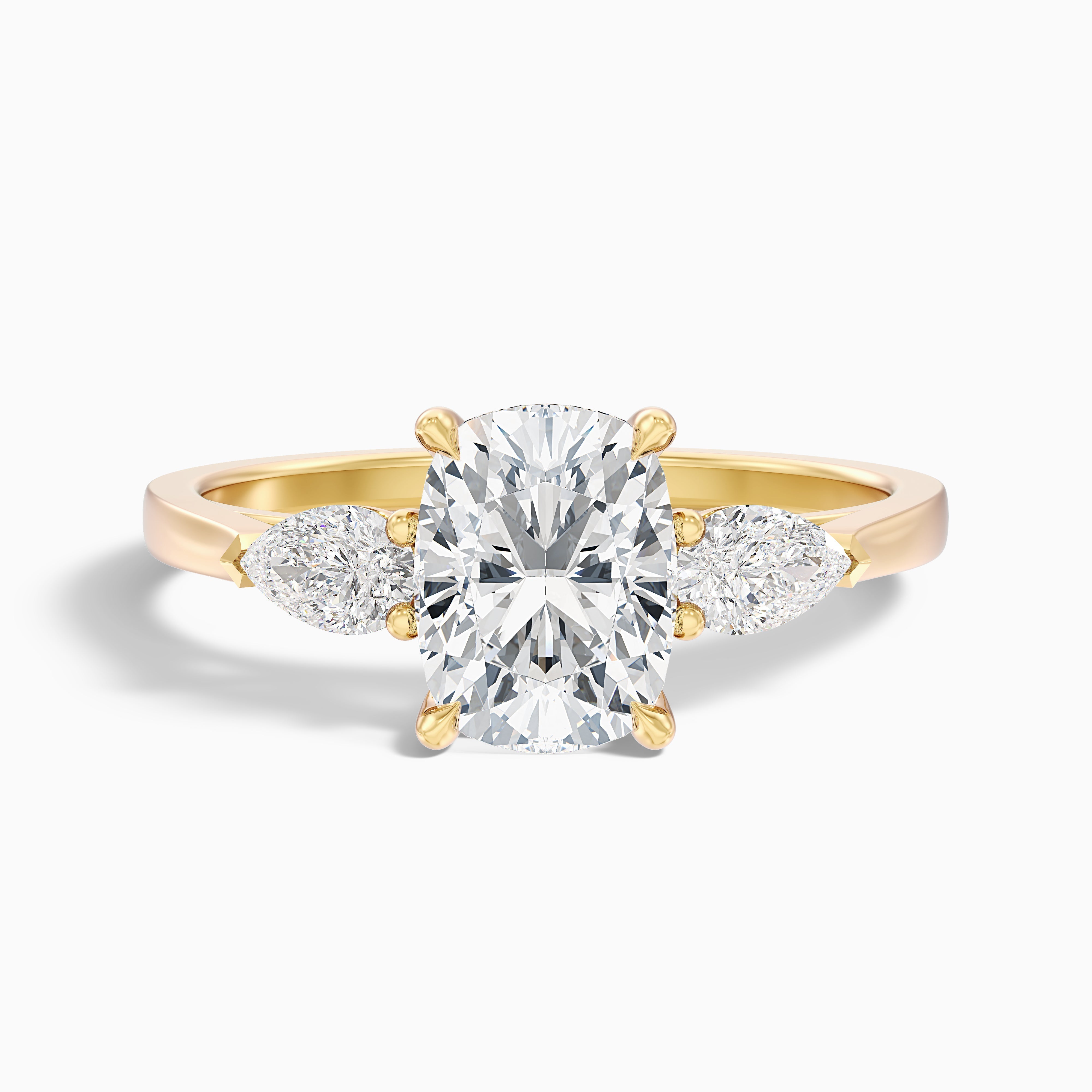Haley 2.5 Carat Three Stone Ring with Pear Side Stones and an Elongated Cushion Lab Grown Diamond in 14k Yellow Gold