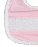 Geometric Smocked Pink Knit Bib Smockingbird