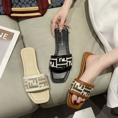 Women's slippers for external wear 2023 new flat bottomed one line mop trend versatile home slippers embroidered letter sandals
