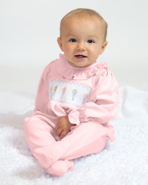 Baby Rattle Smocked Knit Onesie In Pink Smockingbird